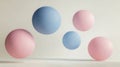 Five floating spheres in soft pastel colors against a light background Royalty Free Stock Photo