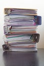 Five folders with documents stacked in a pile on the table Royalty Free Stock Photo