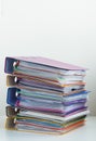 Five folders with documents stacked in a pile on the table Royalty Free Stock Photo