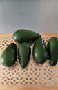 Five fresh avocados on the table