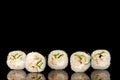 Five fresh sushi rolls in reflection