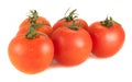 Five fresh tomatoes on a white background