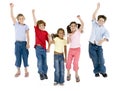 Five friends jumping and smiling Royalty Free Stock Photo