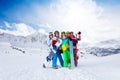 Five friends standing with snowboards Royalty Free Stock Photo