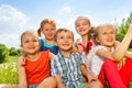 Five funny kids on a meadow