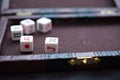 Five gambling dices on an old-fashioned background