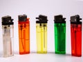 Five gas lighters in different colours on a white background Royalty Free Stock Photo