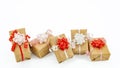 Five gifts beautifully wrapped with a bow Royalty Free Stock Photo