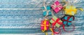 Five gifts. Gift boxes with origami ribbons. Blue turquoise background