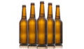 Five glass beer bottles isolated on white background Royalty Free Stock Photo