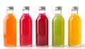 Five glass bottles containing different color liquids, without labels or text. Some condense from the cold bottles