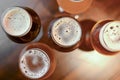 Three glasses with different beer on wooden table in a bar. Food photography concept, with copy space Royalty Free Stock Photo