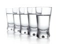 Five glasses of vodka isolated on white Royalty Free Stock Photo