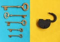 Five golden keys in different direction on blue felt and open pa Royalty Free Stock Photo