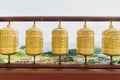 Five golden prayer wheels at Sanbanggulsa temple, Sanbang-ro, Jeju Island, South Korea