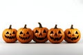 Five gouged jack-o-lantern pumpkins, Halloween image on a white isolated background Royalty Free Stock Photo