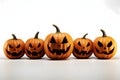 Five gouged jack-o-lantern pumpkins, Halloween image on a white isolated background Royalty Free Stock Photo