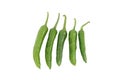 Five green chillis on white background Royalty Free Stock Photo