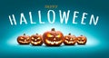 Five halloween, Jack O Lanterns, with evil spooky eyes and faces isolated against a blue lit background with the words Happy Royalty Free Stock Photo