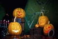 Five Halloween pumpkins, merry faces on a blue background. Royalty Free Stock Photo