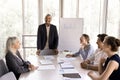 Five happy diverse teammates laughing at briefing in office Royalty Free Stock Photo