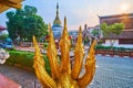 Golden Nagas against the chedi of Wat Buppharam, Chiang Mai, Thailand