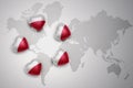 five hearts with national flag of poland on a world map background. Royalty Free Stock Photo
