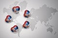 five hearts with national flag of serbia on a world map background. Royalty Free Stock Photo