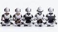 Five humanoid robots sit in a row, each holding a tablet computer, with a white background Royalty Free Stock Photo