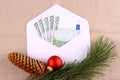 Five hundred euro money in envelope with Christmas deco