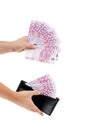 Five hundred euro notes in hand and purse. Royalty Free Stock Photo