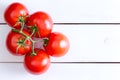 Five Hydroponic tomatoes over white wooden table