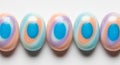 Five Swirled Pastel and Blue Easter Eggs in a Row on White holiday spring Royalty Free Stock Photo
