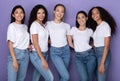 Five Joyful Diverse Ladies Posing Embracing And Smiling, Purple Background