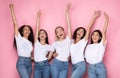 Five Joyful Diverse Ladies Posing Raising Hands Over Pink Background
