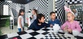 five kids discuss the game in the chess quest room Royalty Free Stock Photo