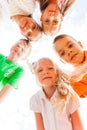 Five kids faces in circle light portrait Royalty Free Stock Photo