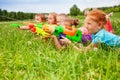 Five kids play with water guns