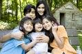 Five kids sitting on bench