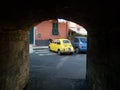 Five Lands, Italy - summer 2020: an iconic yellow Fiat Cinquecento parked in an Italian street