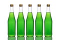 Five large glass bottles with green liquid stand on a mirror surface on a white background in the middle