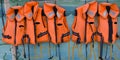 Five life jackets in a row