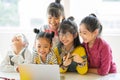 Five little girls are watching video on the computer Royalty Free Stock Photo