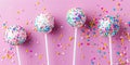 Five lollipops with sprinkles on a pink background Royalty Free Stock Photo