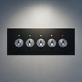Five metallic toggle switches are mounted on a rectangular black metal panel affixed Royalty Free Stock Photo