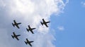 Five military planes flying in the group