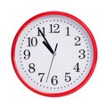 Five minutes to eleven on a round dial Royalty Free Stock Photo