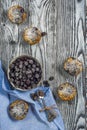 Five muffins with blackcurrant top view, vertical frame Royalty Free Stock Photo