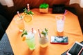 Five non  Alcoholic  summer Cocktail. Alcoholic beverage based on table with ice cubes and oranges Royalty Free Stock Photo