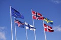 Five Nordic flags on flagpoles with EU flag. Denmark, Sweden, Norway, Finland, Iceland and European Union. Royalty Free Stock Photo